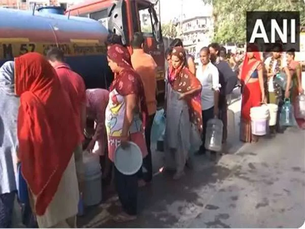 People wait in long queues as Delhi continues to grapple with water shortage